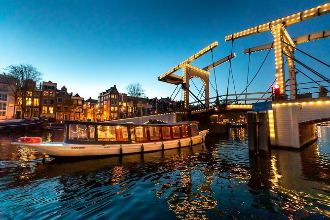 Amsterdam Evening Canal Cruise With Live Guide and Onboard Bar - Meeting Points and Itinerary