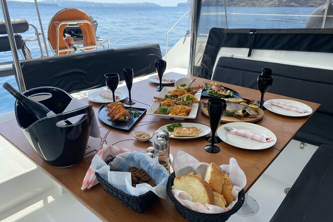 Half Day Premium Catamaran Cruise in Santorini Including Oia - Explore Ammoudi Bay and Thirasia Island