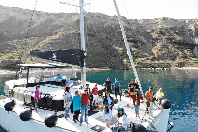 Half-Day Exclusive Catamaran Cruise in Santorini With Meal and Open Bar - Exploring the Red Beach