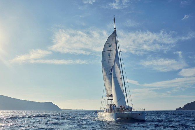 Santorini Sunset Luxury Sailing Catamaran Cruise With BBQ, Drinks, Transfer - Intimate Sailing Experience