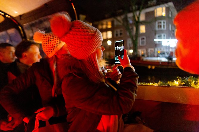 Amsterdam Evening Canal Cruise With Live Guide and Onboard Bar - Unforgettable Sights and Landmarks