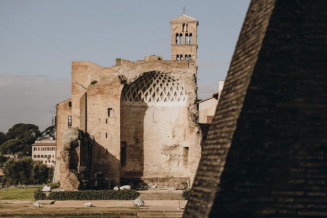 Small-Group Colosseum Tour With Roman Forum & Palatine Hill - Visiting the Temple of the Vestal Virgins and Julius Caesars Resting Place