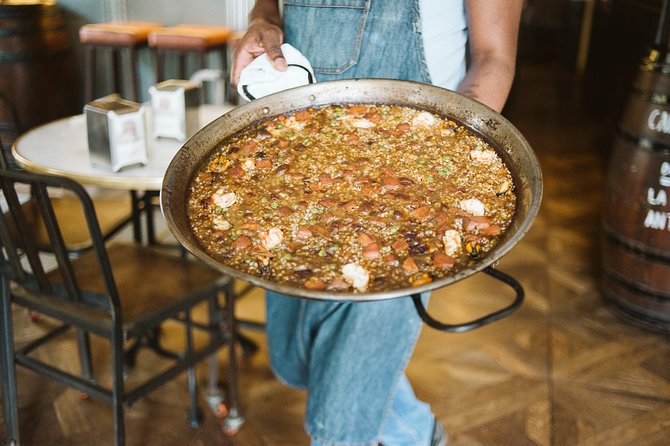 Devour Barcelona Food Tour & Local Market Visit - Enjoying a Seafood Paella Feast